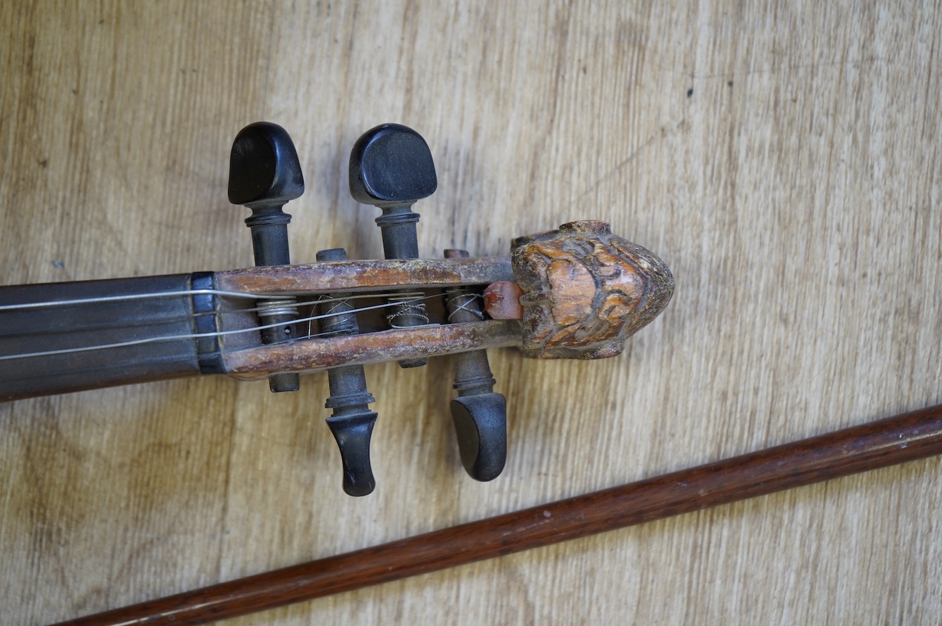 A student’s Golden Strad ‘cello imported by Boosey and Hawkes, body 69.5cm and violin, body 36cm, and a wooden conductors baton. Condition - poor to fair